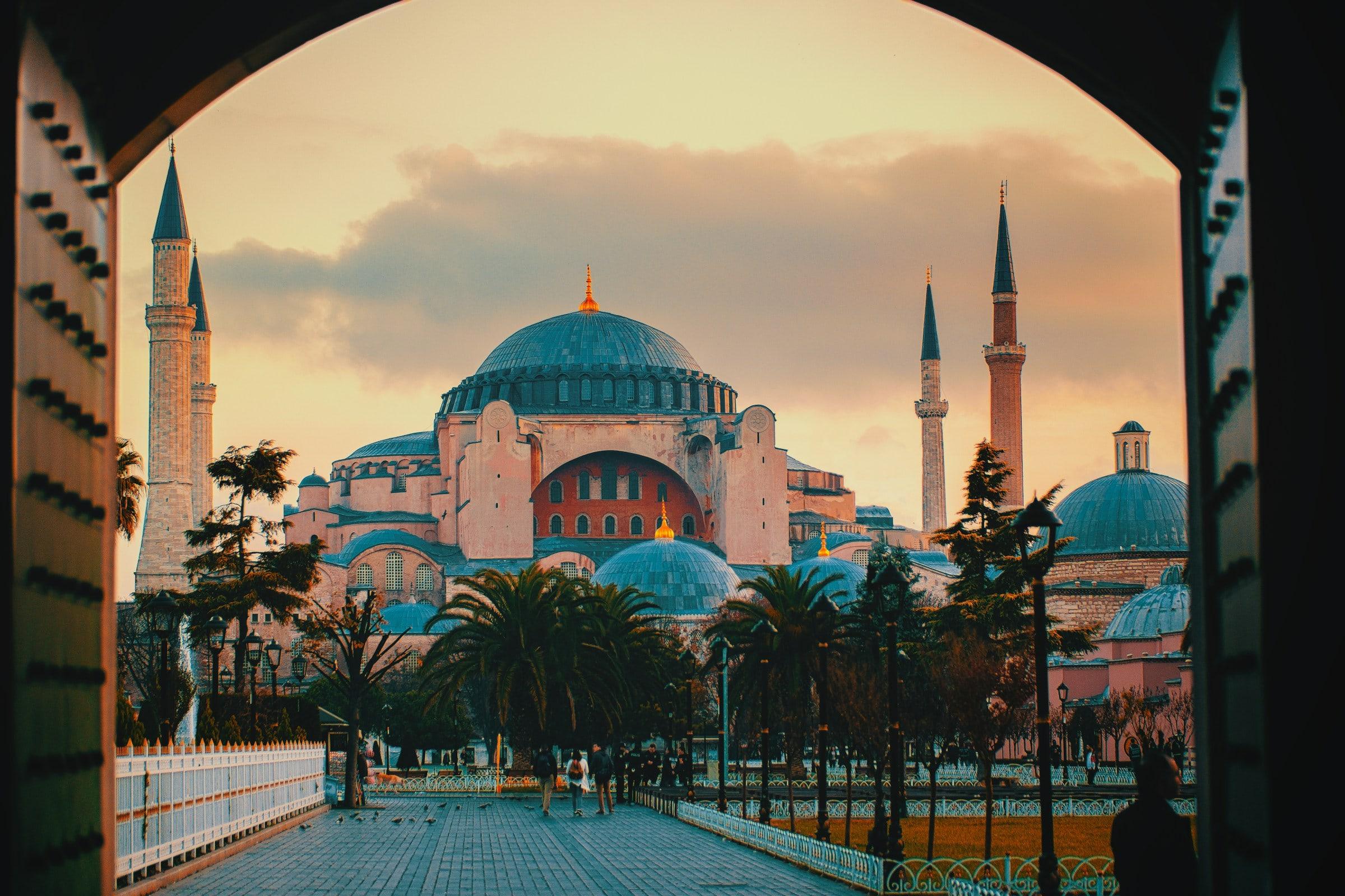 Hagia Sophia at sunset, framed by an arched gateway