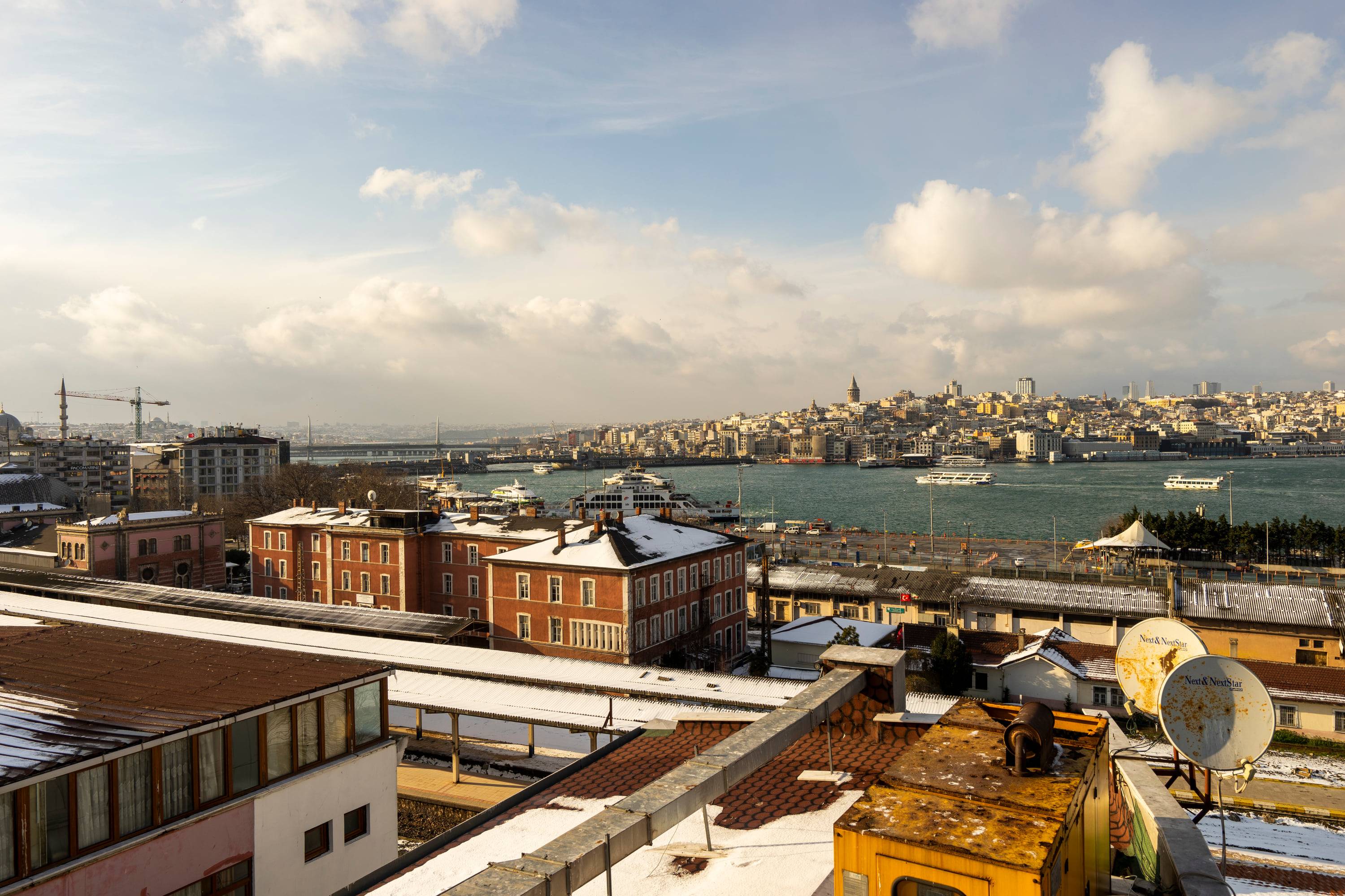 The Golden Horn seen from the hotel's terrace, ferries crossing towards Galata Tower