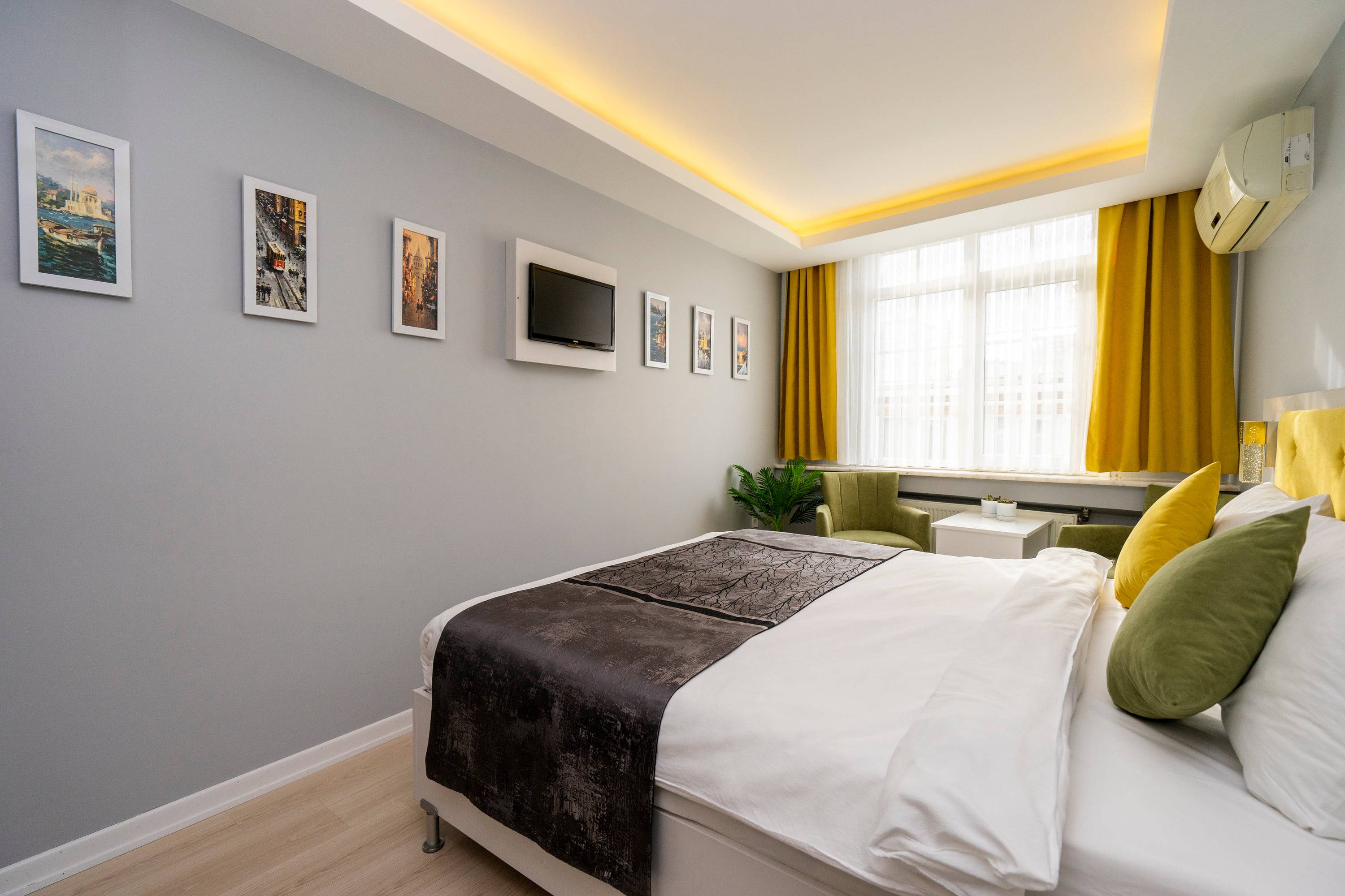 The television wall, hung with a row of framed Istanbul photographs