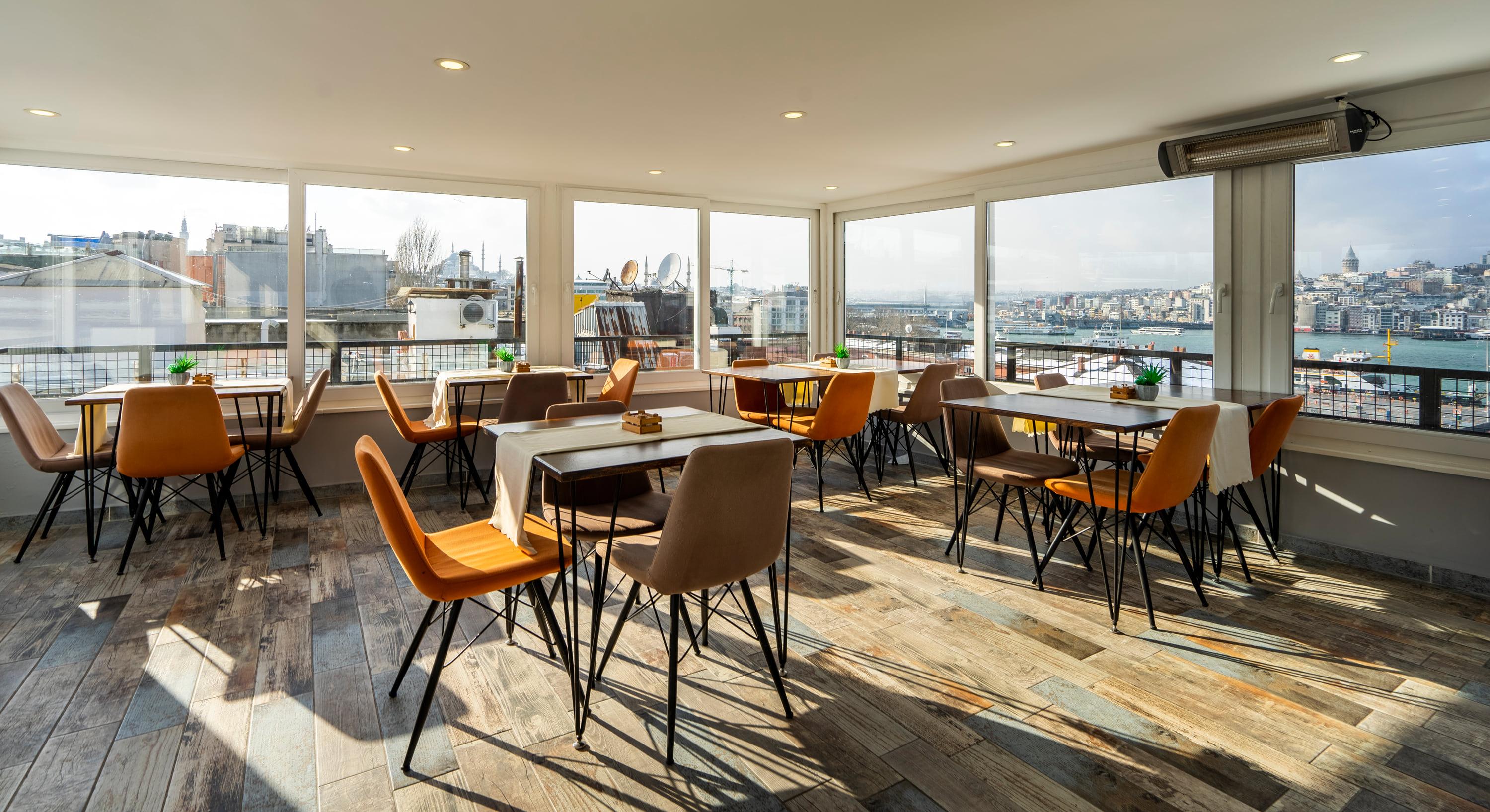 The top-floor room, glazed on three sides with the Golden Horn beyond